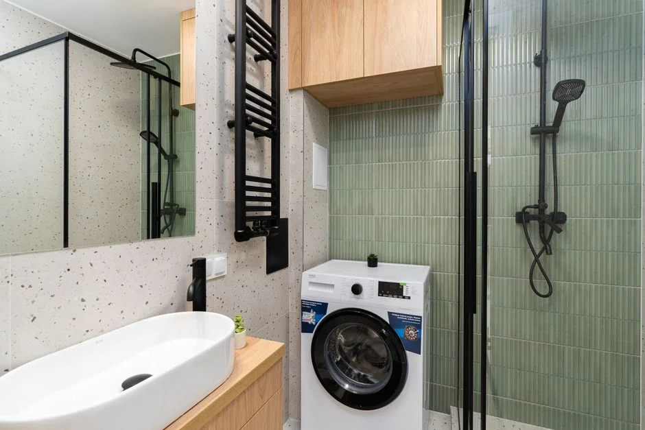Vacuum and tools in a room undergoing renovation, showcasing home improvement.